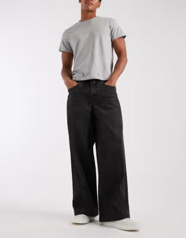 エイソス メンズ ボトムス デニムパンツ 刺繍 ジーンズ ASOS DESIGN loose jeans in washed black with embroidered back pockets and tie waist WASHED BLACK ブラック