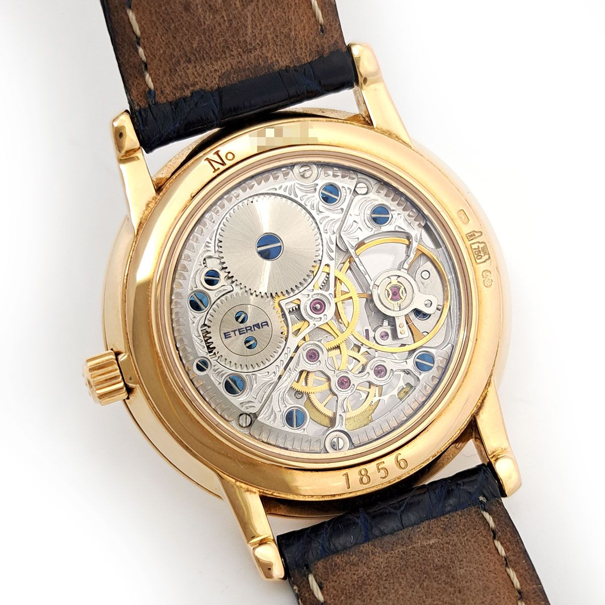 ETERNA エテルナ、アナログ電池式時計 ホワイト/ゴールド エテルナ スケルトン イエローゴールド 1856 手巻き イエローゴールド