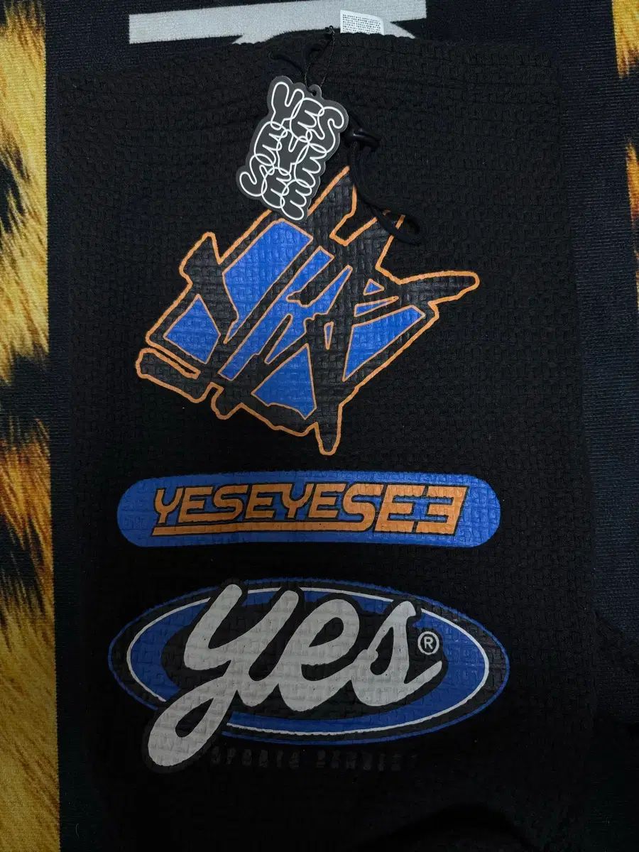 YESEYESEE イェスアイシー ファブリック シャーリングバッグ ブラック