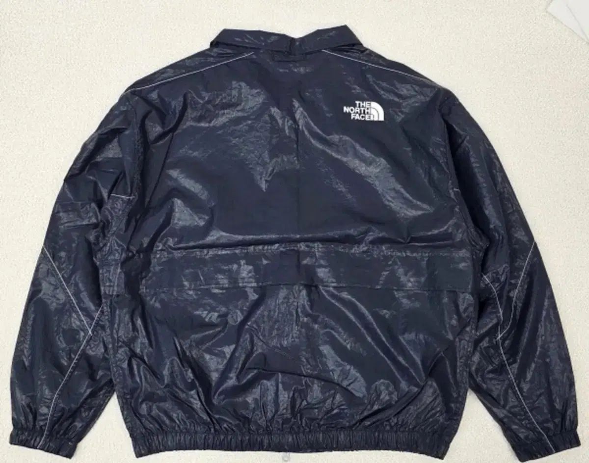 (L)THE NORTH FACE ノベルティ ウィンドブレーカー