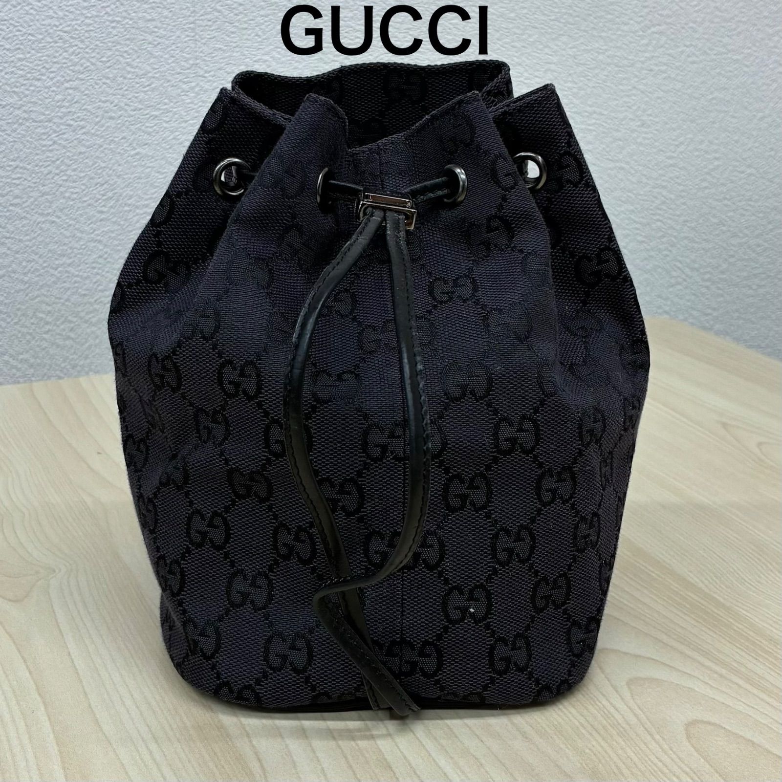 グッチGUCCI】GGキャンバス巾着ポーチ ハンドバッグ ブラック系 - メルカリ