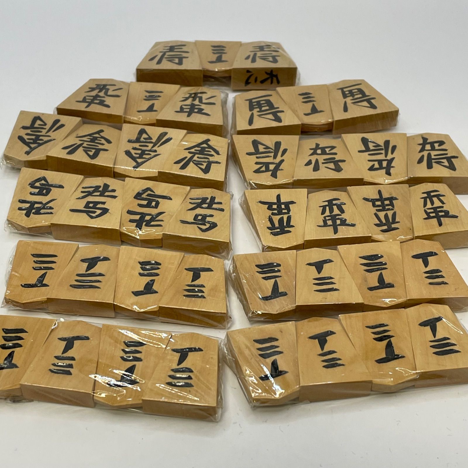 未使用パッケージ 将棋駒 天周堂 四代目 シャム黄楊 黒彫 天心銘 余り