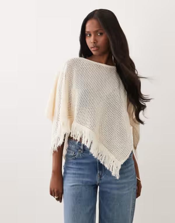 エイソス レディース アウター ニット・セーター ケープデザイン キャップ ケープ フリンジ ASOS DESIGN open knit fringed hem cape in ecru エクリュ