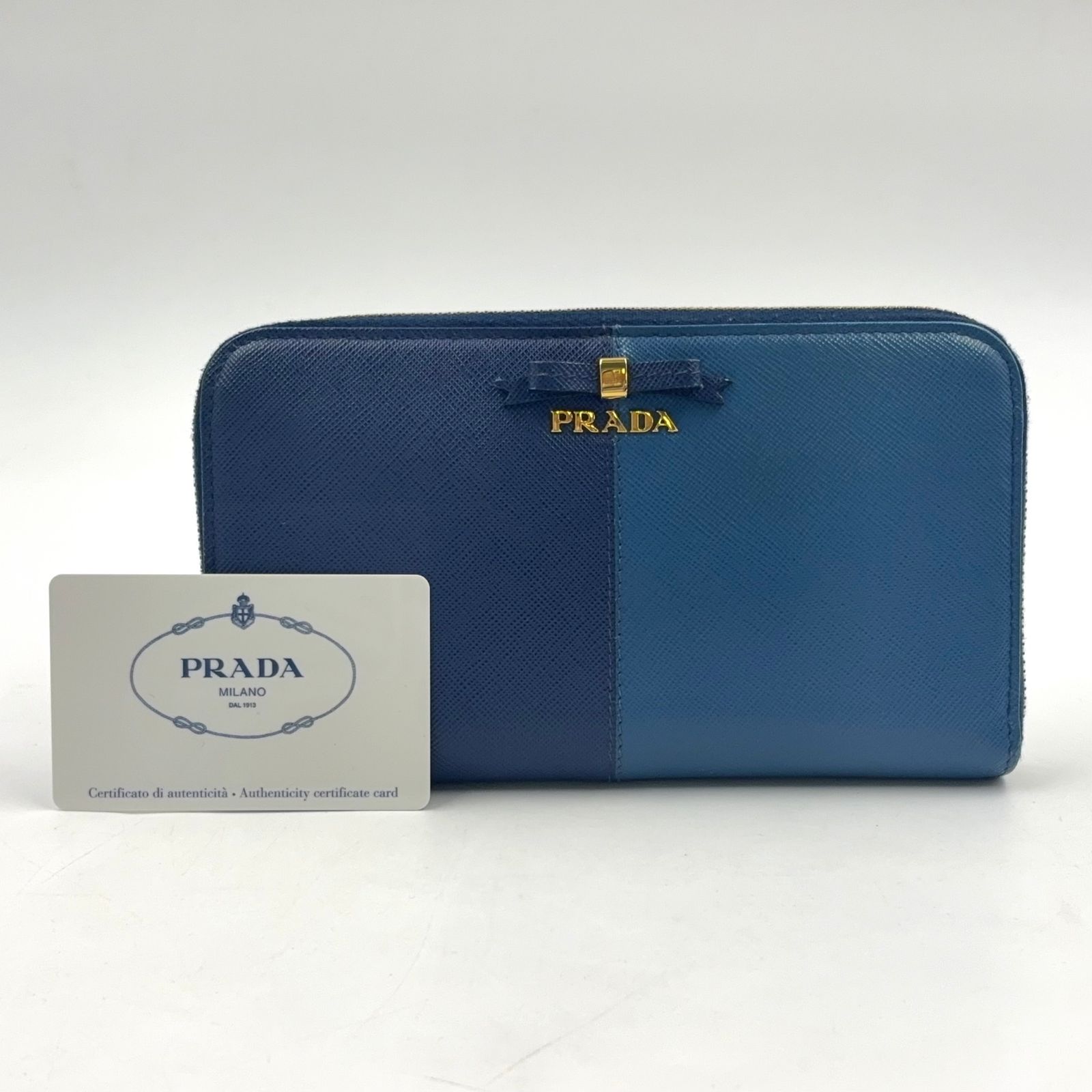 PRADA リボン付き長財布 ライトブルー　正規品 PRADA リボン バイカラー ジップアラウンド レザー ブルー、ライト