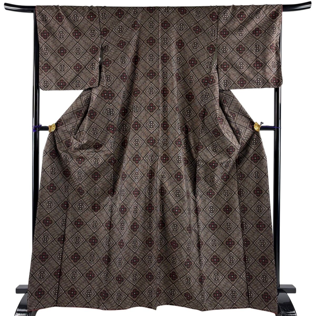 紬 身丈167.5cm 裄丈67cm M 袷 花 幾何学模様 焦茶色 正絹 名品 【中古】