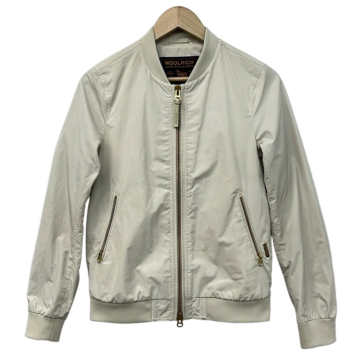 WOOLRICH(ウールリッチ) ブルゾン サイズS レディース - アイボリー 長袖/ジップアップ/秋/春