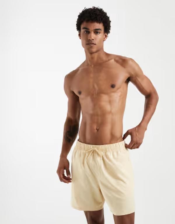 エイソス メンズ 水着 ハーフパンツ・ショーツ ショートパンツ ASOS DESIGN swim shorts in mid length in yellow イエロー