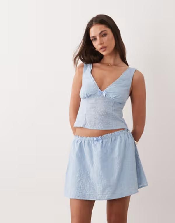 ザ・フロリック レディース ボトムスカート フリル ミニ コットン The Frolic Exclusive cotton bow detail ruffle mini skirt BLUE ブルー