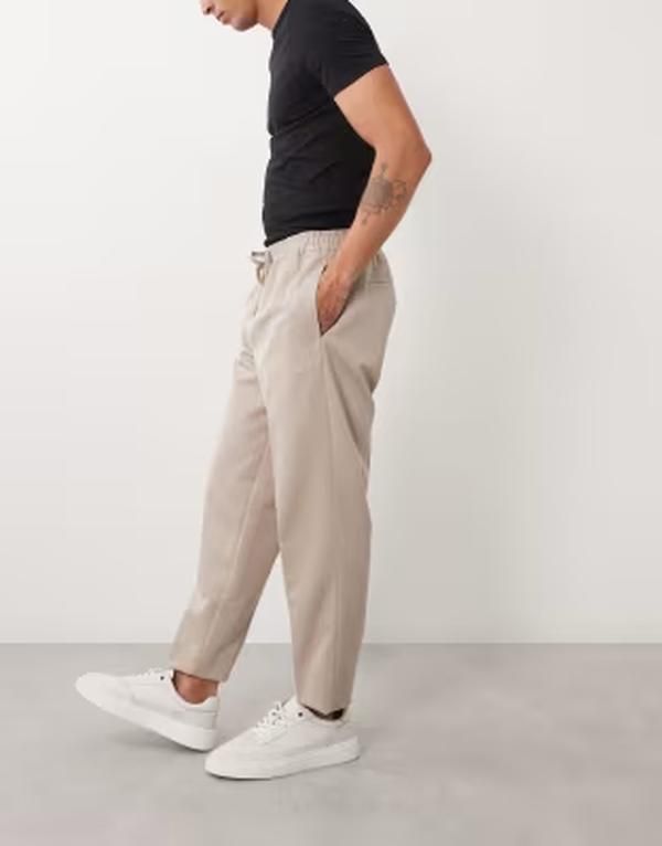 エイソス メンズ ボトムス カジュアルパンツ ASOS DESIGN tailored pull on tapered pants in stone ストーン
