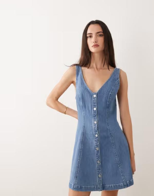 グッドアメリカン レディース トップス ワンピース Vネック ミニ ノースリーブ デニム Good American denim vneck sleeveless mini dress in mid グッドアメリカン レディース トップス ワンピース Vネック ミニ ノースリーブ デニム Good American denim vneck sleeveless mini dress in mid