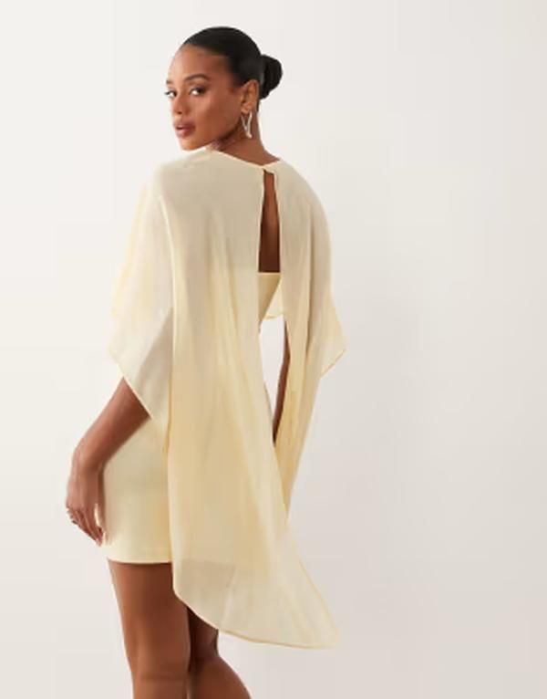 ジーナトリコ レディース トップス ワンピース ケープデザイン ミニ キャップ ケープ Gina Tricot cape mini dress in pale yellow Pastel Yellow