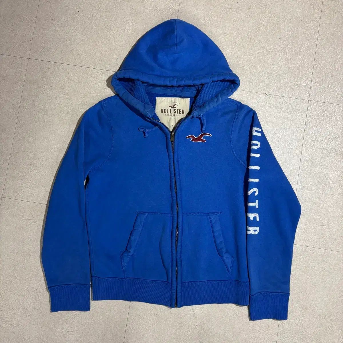 Hollister サイドロゴ ブルー フーディー ジップアップ - メルカリ
