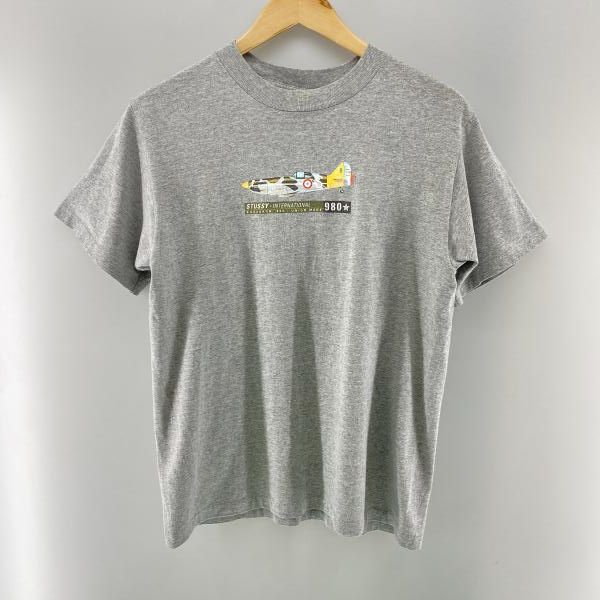 【中古】STUSSY 90s 紺タグ 戦闘機 Tシャツ グレー サイズM ステューシー[24]