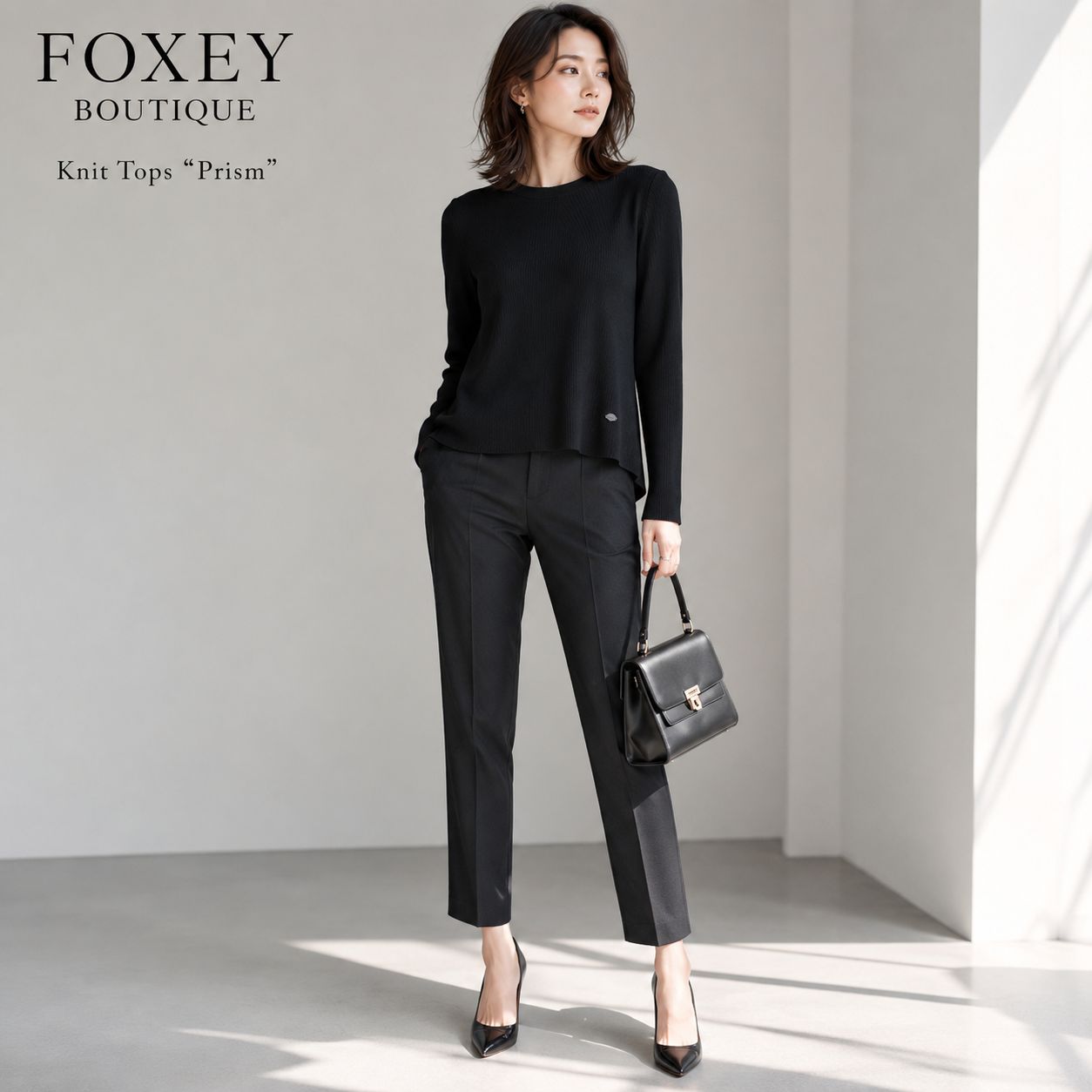 【美品 / 洗練された前後差アシンメトリー ヘムライン】FOXEY BOUTIQUE / フォクシーブティック ニットトップス プリズム 40 ブラック レーヨンBLENDリブ ロゴプレート付 ヒップ周りを優美にカバー 18,352円