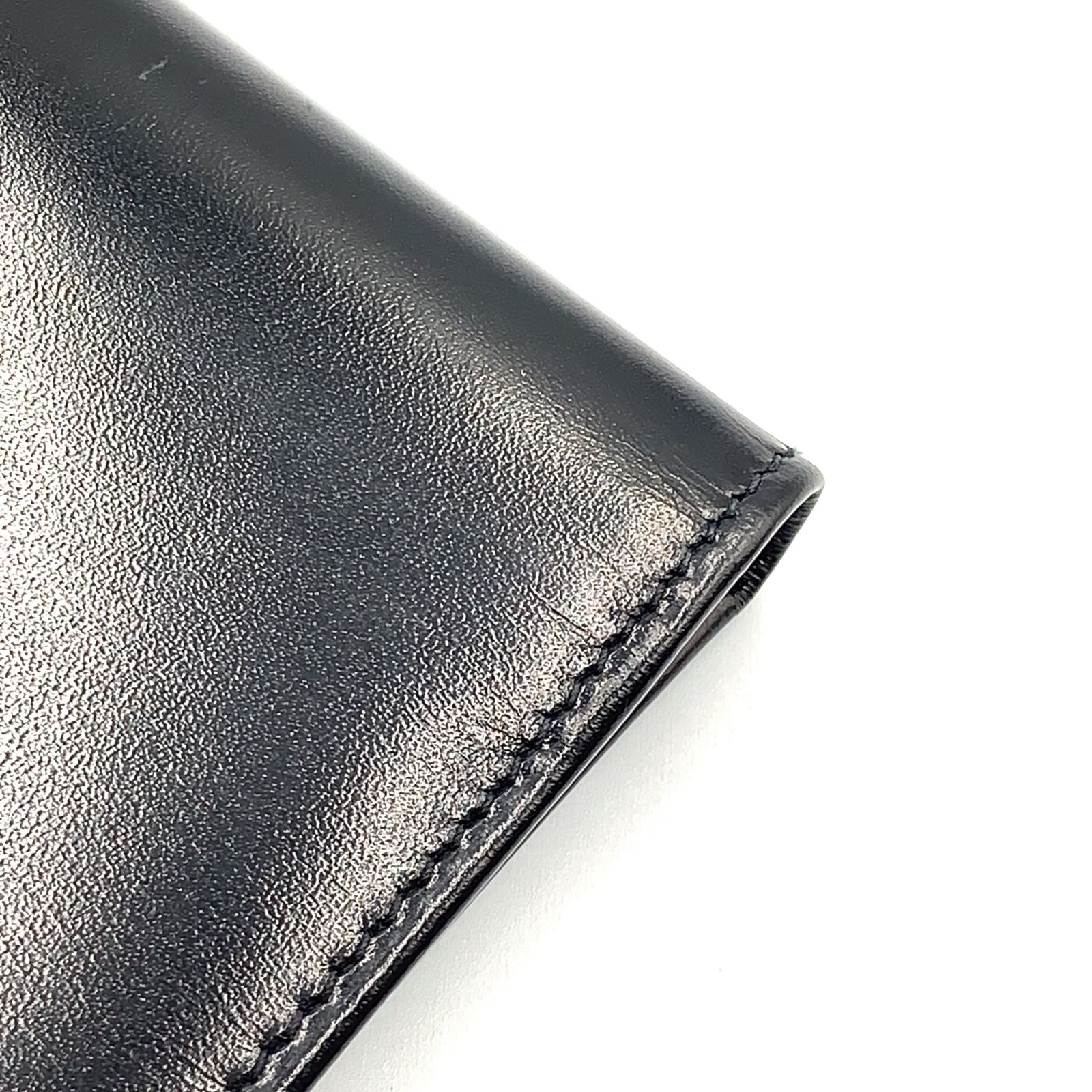 新着】PRADA コーナーメタルロゴ レザー ブラック 二つ折り長財布