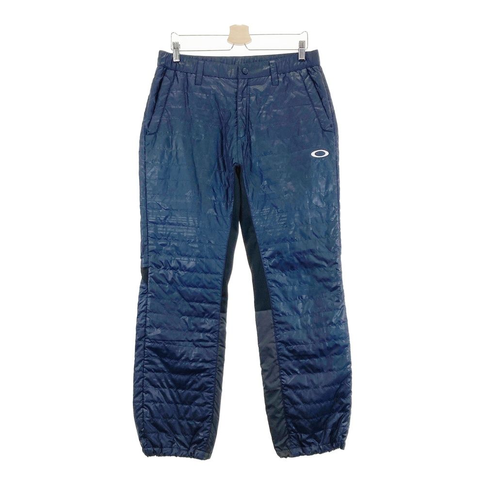 サイズ：L OAKLEY オークリー ;422065JP 中綿パンツ ロゴ×総柄 ネイビー系 [240101488582] ゴルフウェア メンズ ストスト