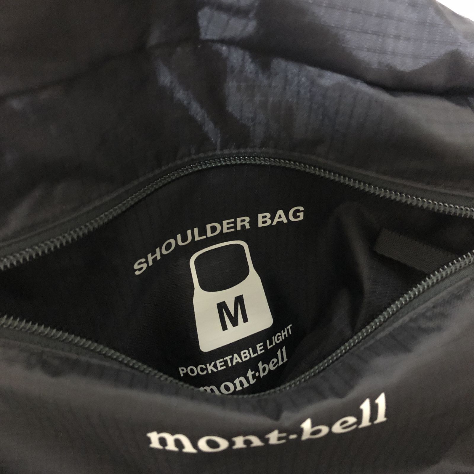 D565 mont-bell ポケッタブルショルダーバッグM 黒 265775632 - メルカリ