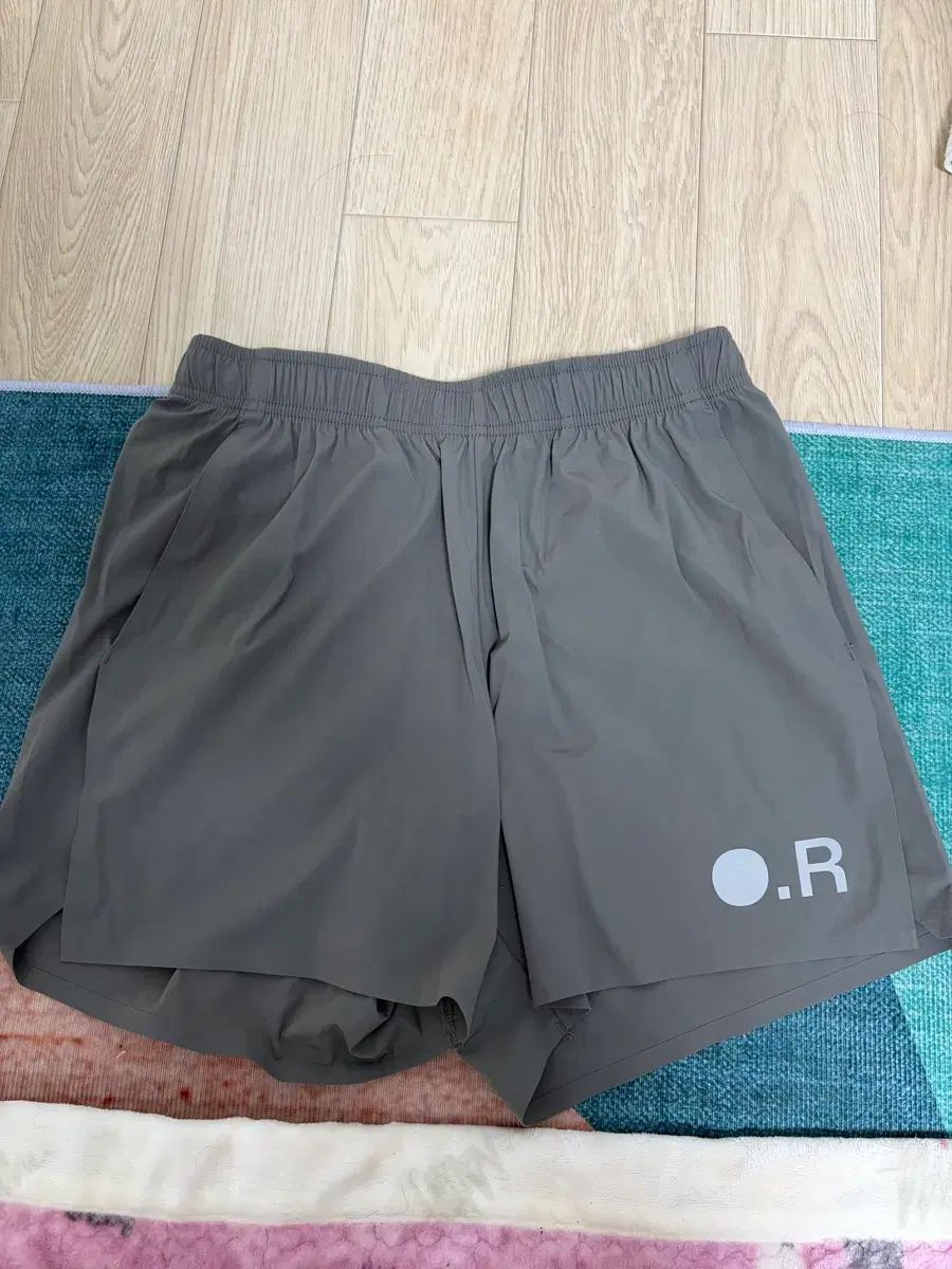 オプティミスティックランナーズ ルーズショーツ ブラウン S