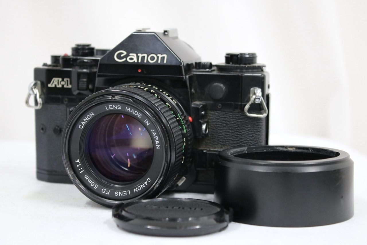 【返品保証】 キャノン Canon A-1 NEWFD 50mm F1.4 ボディレンズセット e14184