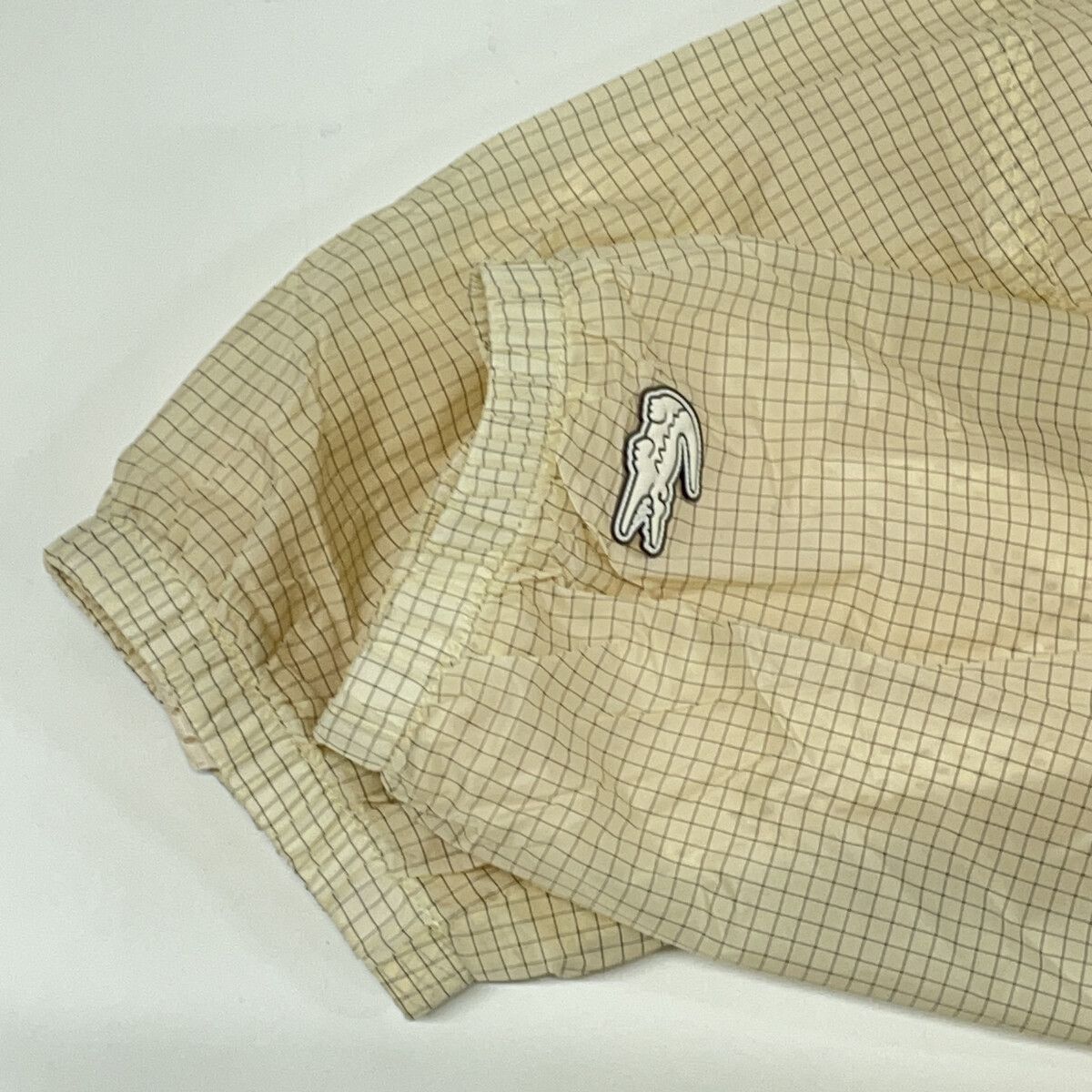 Lacoste ラコステ BH0122-99 ベージュ グリッドナイロンジップアップ