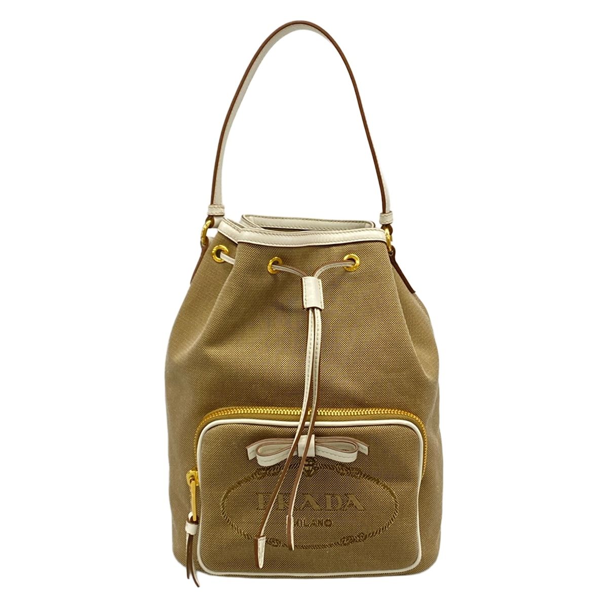 PRADA(プラダ) ハンドバッグ美品 ロゴジャガード 1BH097 ベージュ×白 巾着型/リボン レザー