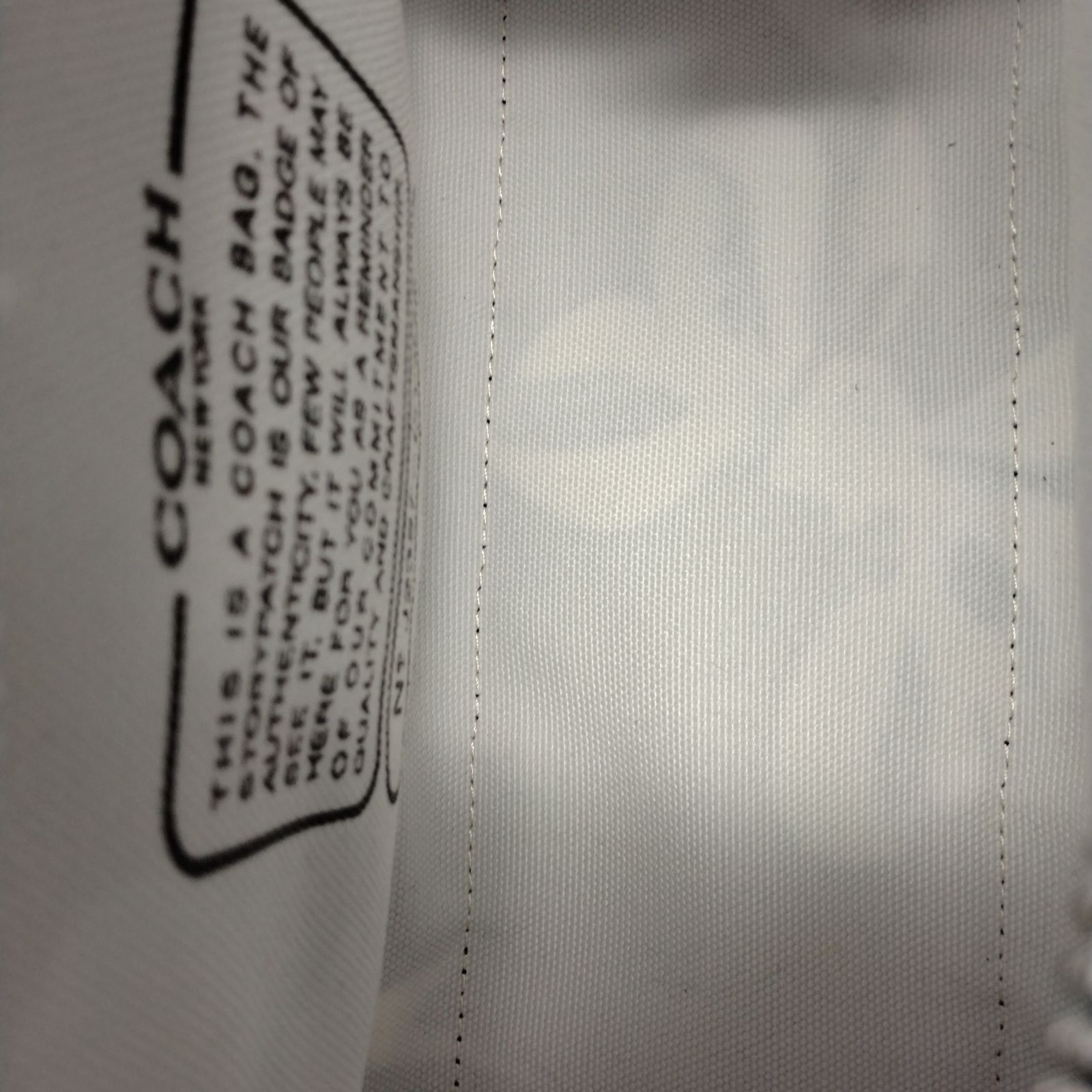 新品未使用】Coach ブラックカーゴトートバッグ リボン柄キャンバス26