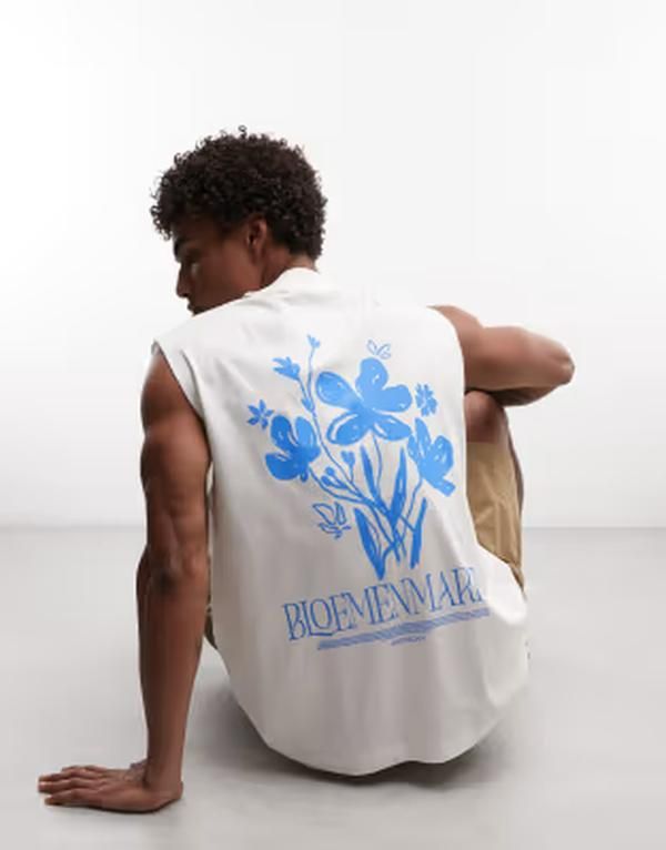 エイソス メンズ トップス ベスト フラワー柄 フラワー グラフィック ASOS DESIGN oversized tank with floral graphic in cream Coconut