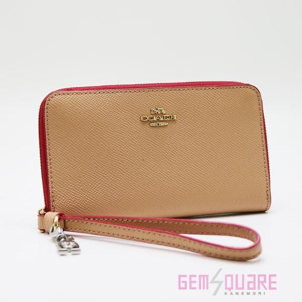 COACH コーチ フォンウォレットウィズチャーム 財布 ベージュ ピンク 新品同様品 F29943