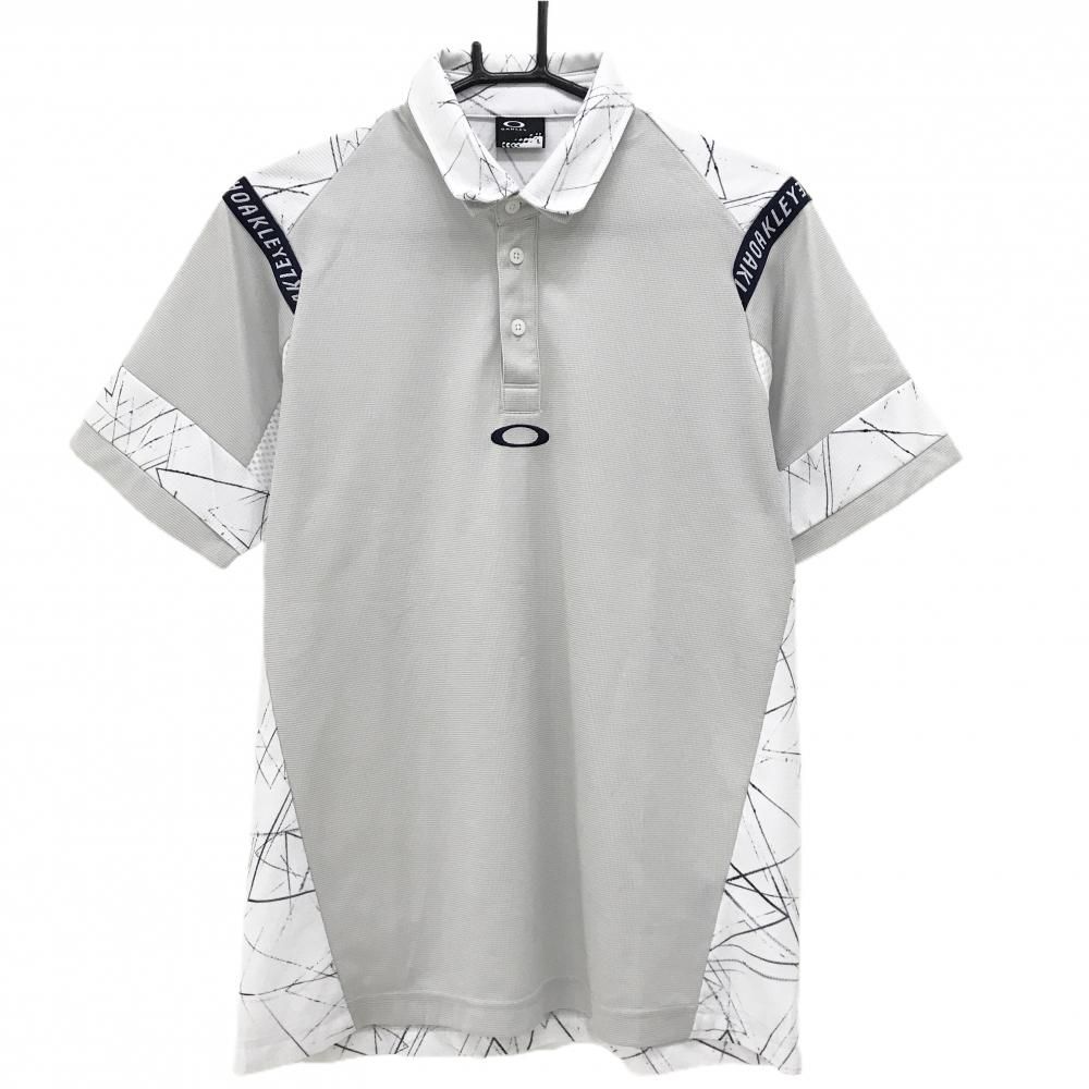 美品】オークリー 半袖ポロシャツ ライトグレー×白 背面総柄 ロゴ 