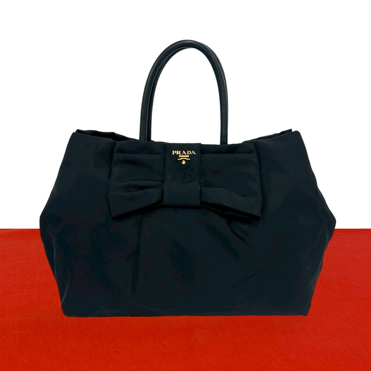 極 美品 PRADA プラダ ロゴ 金具 リボン モチーフ ナイロン レザー 本