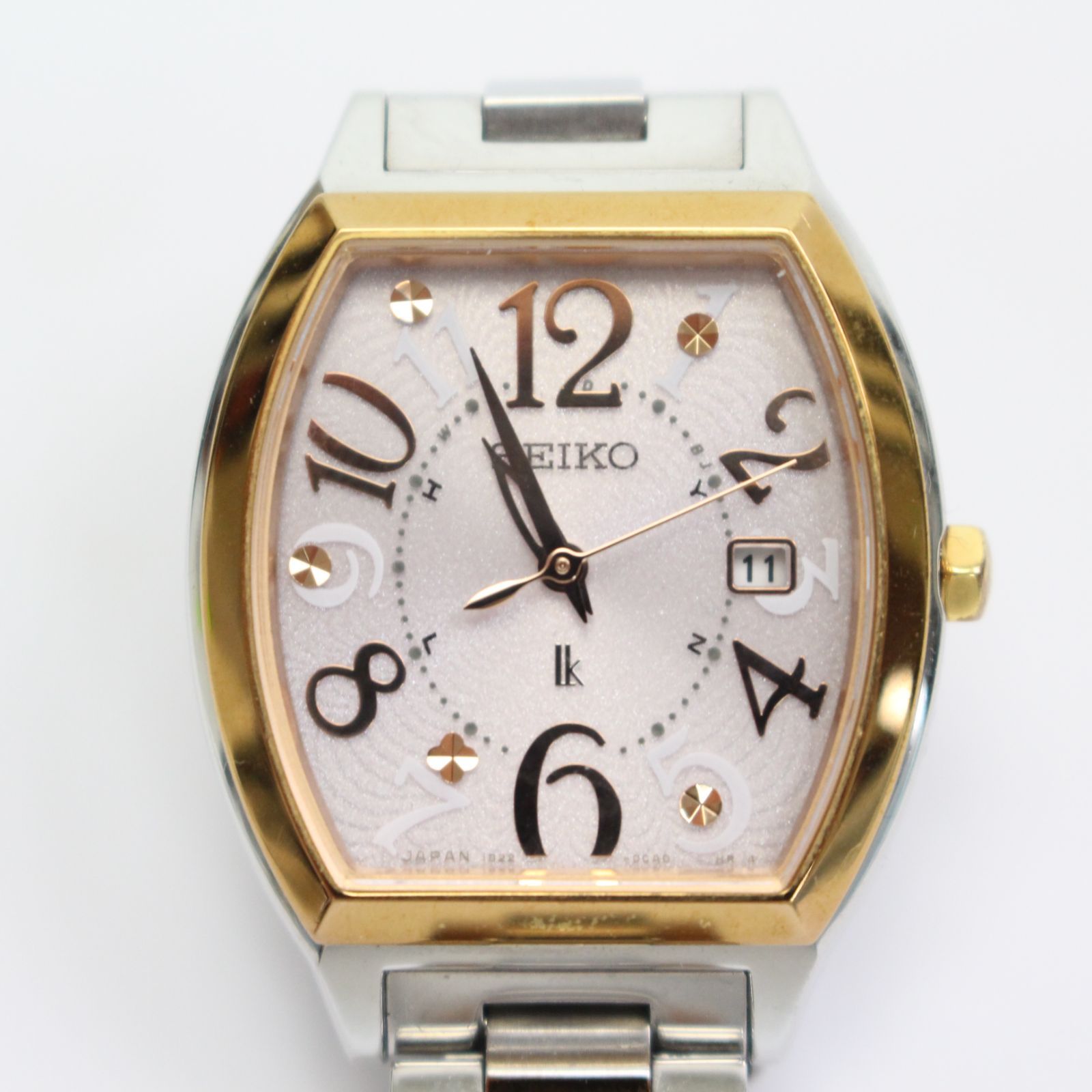 IS720)SEIKO セイコー ルキア 電波ソーラー腕時計 1B22-0BB0 カレンダー付き デイト ピンク文字 トノー型盤