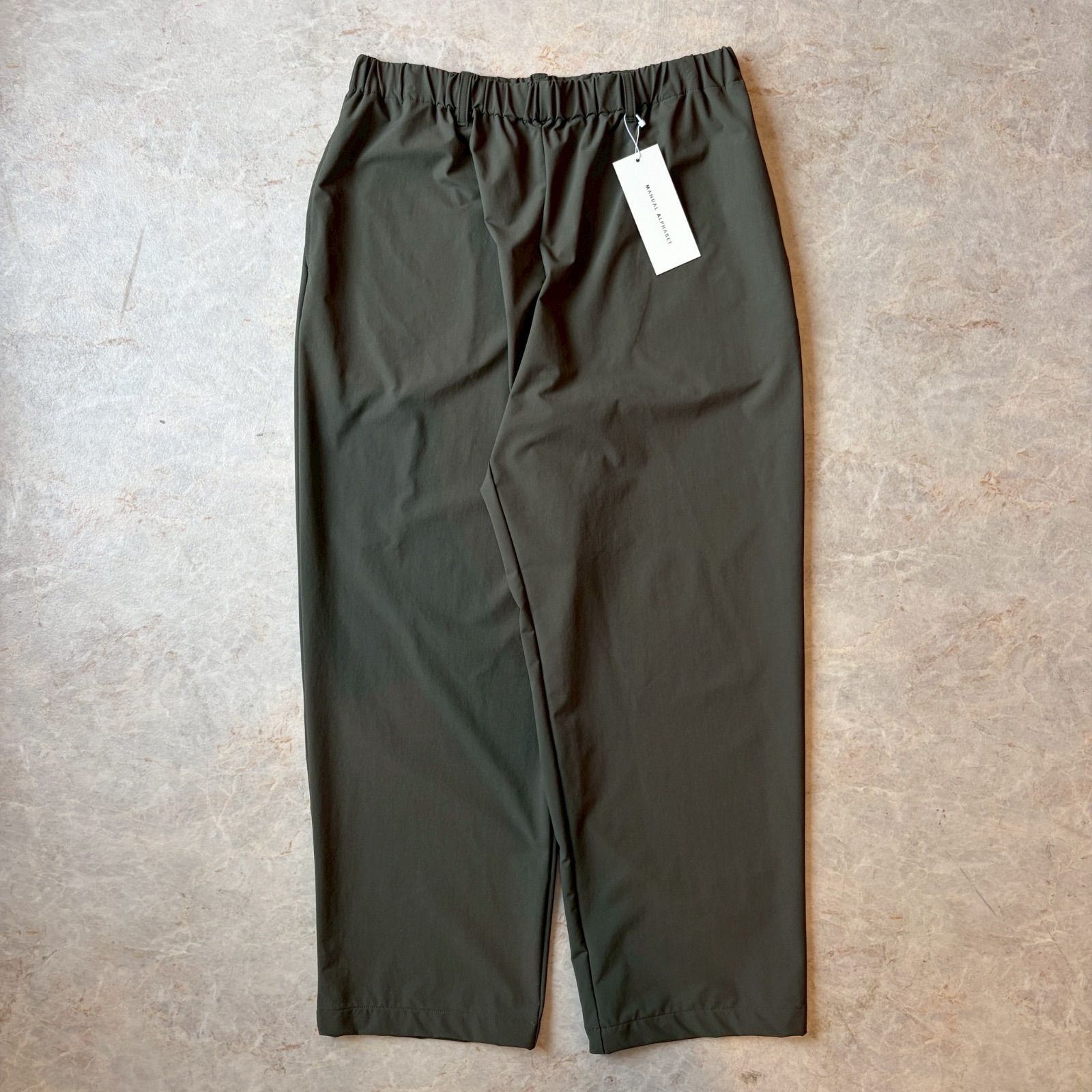 MANUAL ALPHABET マニュアルアルファベット　4WAY NYLON EASY WIDE PANTS (OLIVE) サイズ３