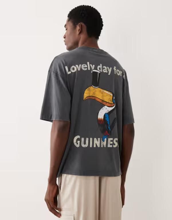 エイソス メンズ トップス Tシャツ プリント ASOS DESIGN oversized tshirt with Guinness print in washed BLACK ブラック