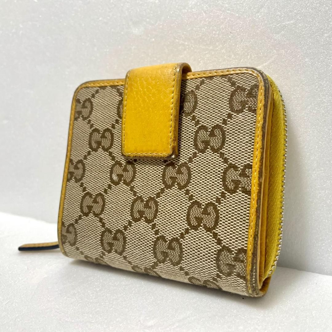 GUCCI グッチ GGキャンバス 二つ折り財布 イエロー レザー スナップ式 小銭入れ付き レディース コンパクトウォレット ベージュ 黄色 ロゴ柄 総柄 ファスナー コインケース カードケース ブランド財布 中古 ヴィンテージ風 小型 携帯用 普段使い