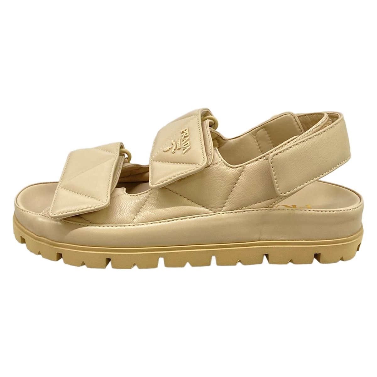 PRADA(プラダ) サンダル 34 1/2 レディース美品 - ベージュ キルティング/スポーツサンダル/ベルクロ レザー