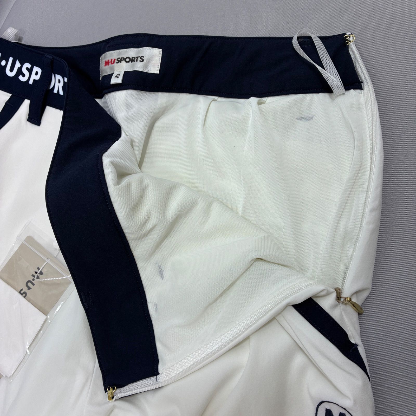 新品 M・U SPORTS レディース ゴルフパンツ 40(M) ホワイト ストレッチ