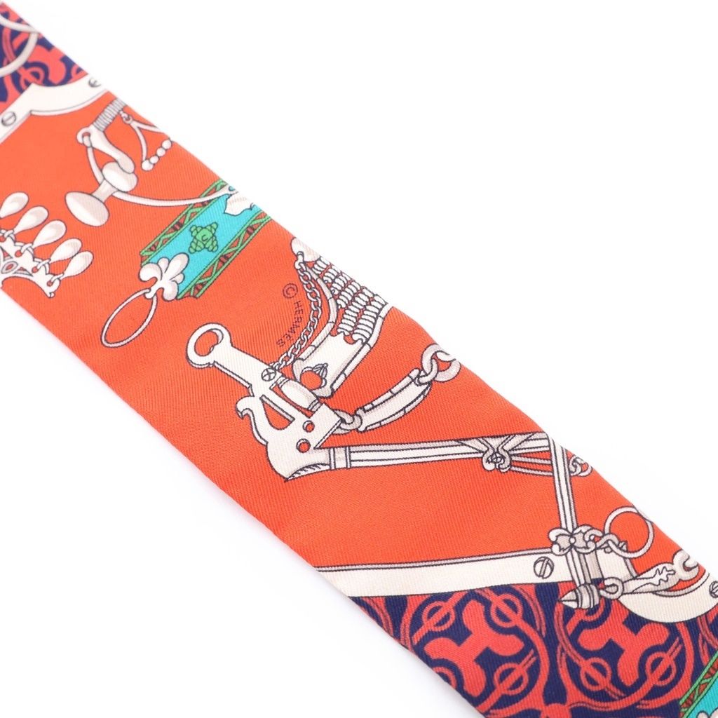 エルメス HERMES ツイリー 馬銜と鎖 スカーフ ピンク系 タグあり HERMES (エルメス) ツイリー 馬銜と鎖 シルクスカーフ レッド×ネイビー