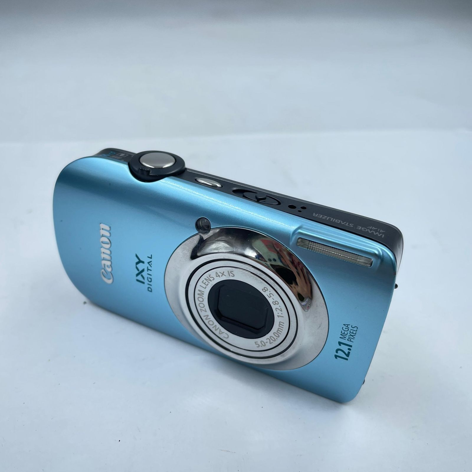 7F3Canon Canon IXY DIGITAL 12.1MEGA PIXELS 4x PC1356 Digital Camera Blue Used