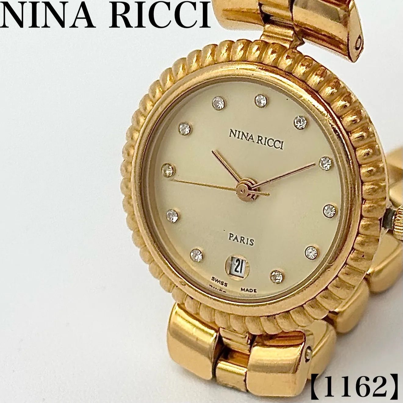 稼働品 Working item ニナリッチ NINA RICCI 腕時計 レディース Ladies クォーツ Quartz D952 ゴールド 12P ダイヤモンド調 ストーン デイト 日付表示 ラウンドフェイス 丸型 金メッキ 1162