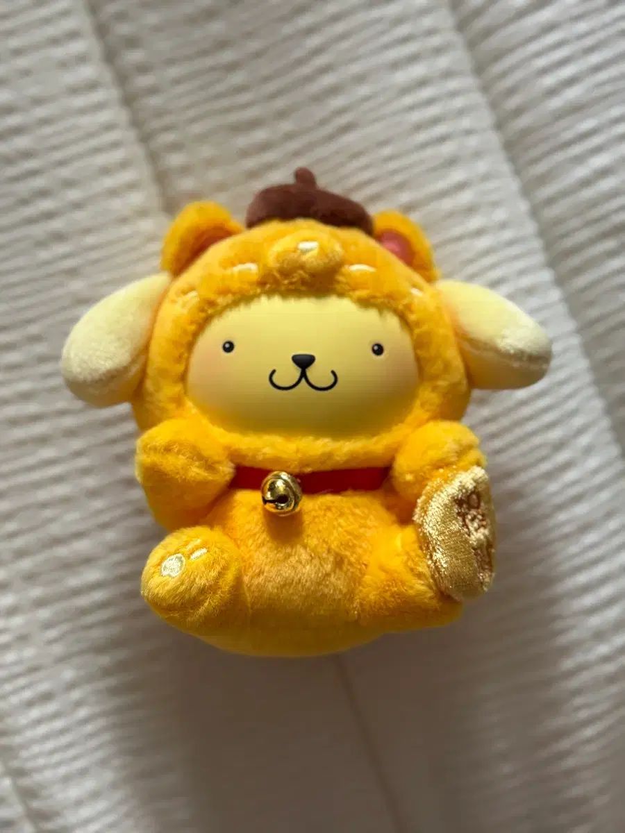 Gato que hace señas con Pompompurin
