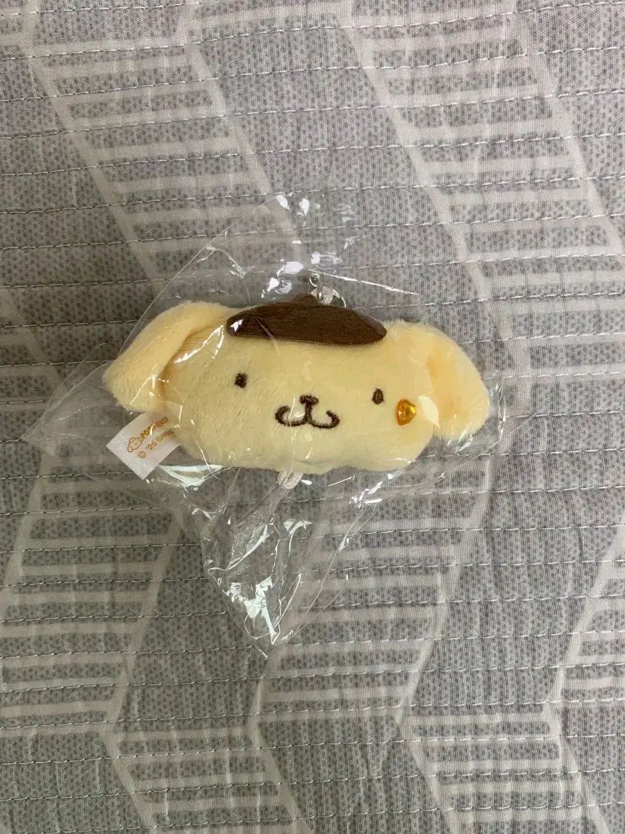 Llavero con cara de Pompompurin de Sanrio