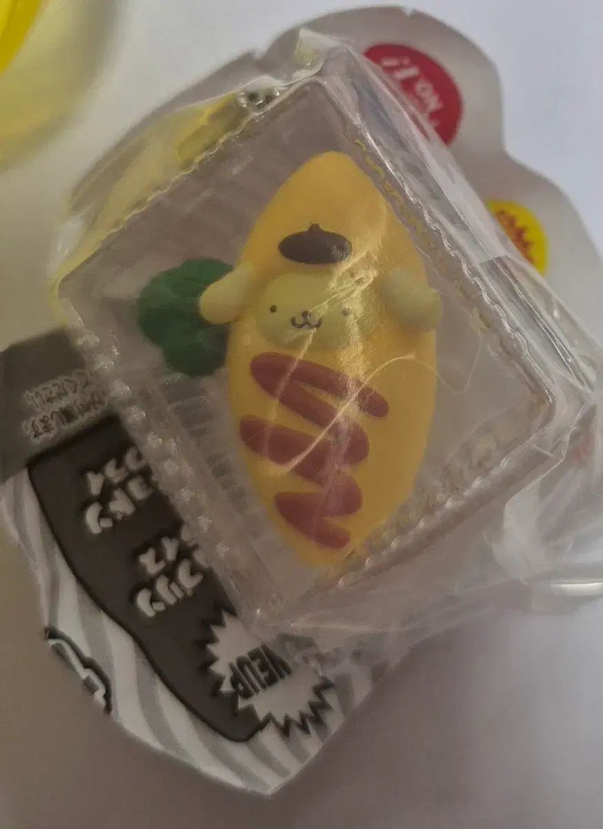 Guarnición de Sanrio gacha (Pompompurin)