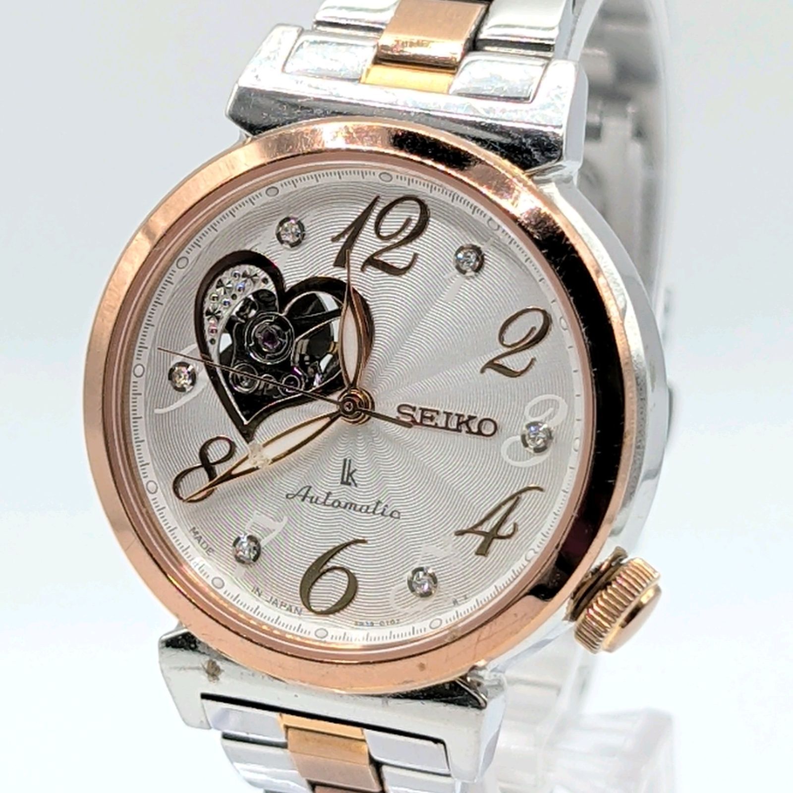 SEIKO Lukia 4R38-01C0 Watch Automatic Ladies Silver Gold combi Stones Heart Y2K 00S セイコー エンブレム 時計 自動巻き レディース シルバー ラウンド 裏スケルトン 稼働品