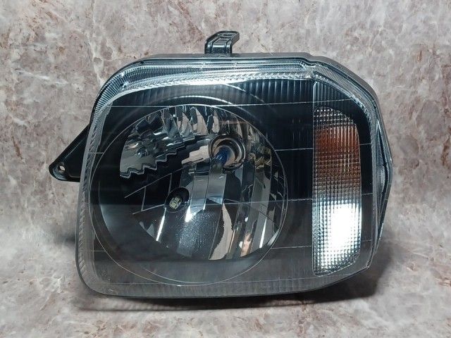 ジムニー JB23W 左ヘッドランプ・ヘッドライト ワイルドウインド