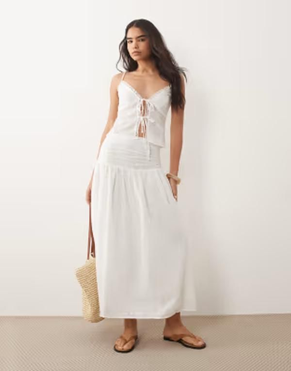ザ・フロリック レディース ボトムスカート コットン マキシ The Frolic exclusive cotton broderie shirredrop waist maxi skirt WHIT