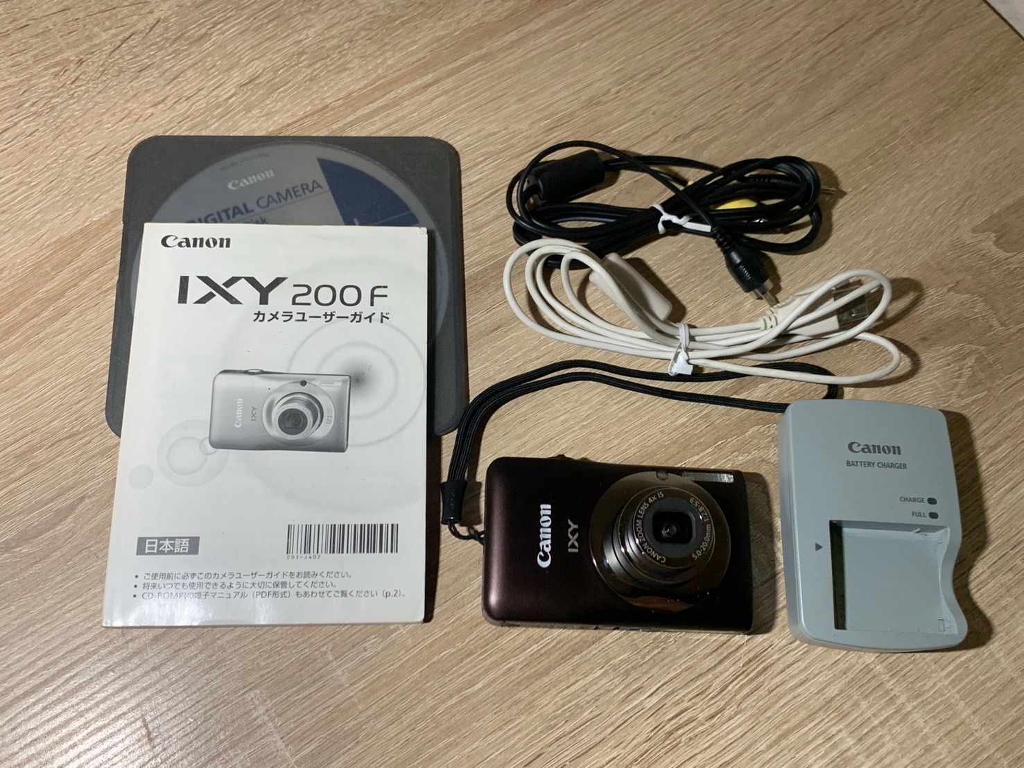 2948 Canon IXY 200 brown junk digital camera [co]