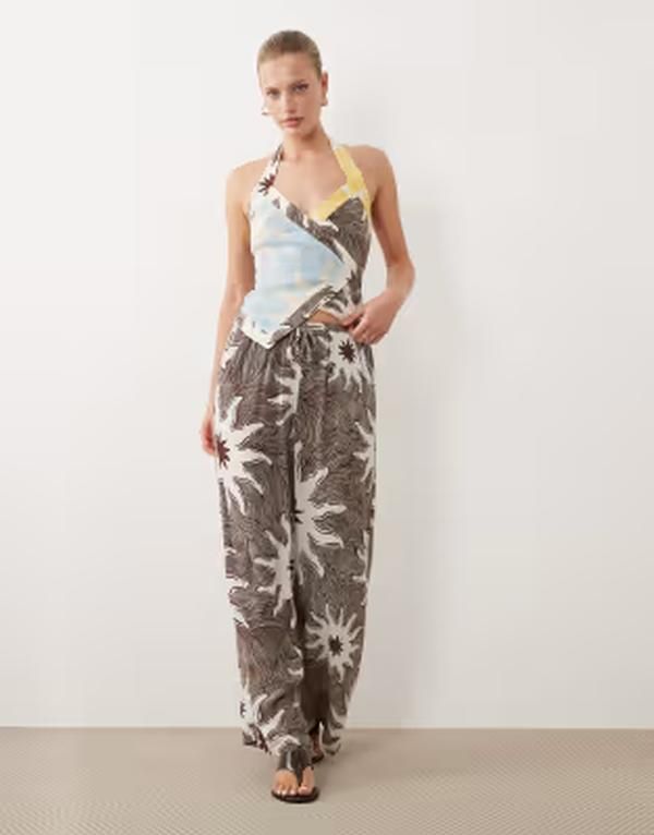 ネバーフリードレスド レディース ボトムス カジュアルパンツ ワイドレッグ プリント Never Fully Dressed wide leg drawstring pantsoleil print