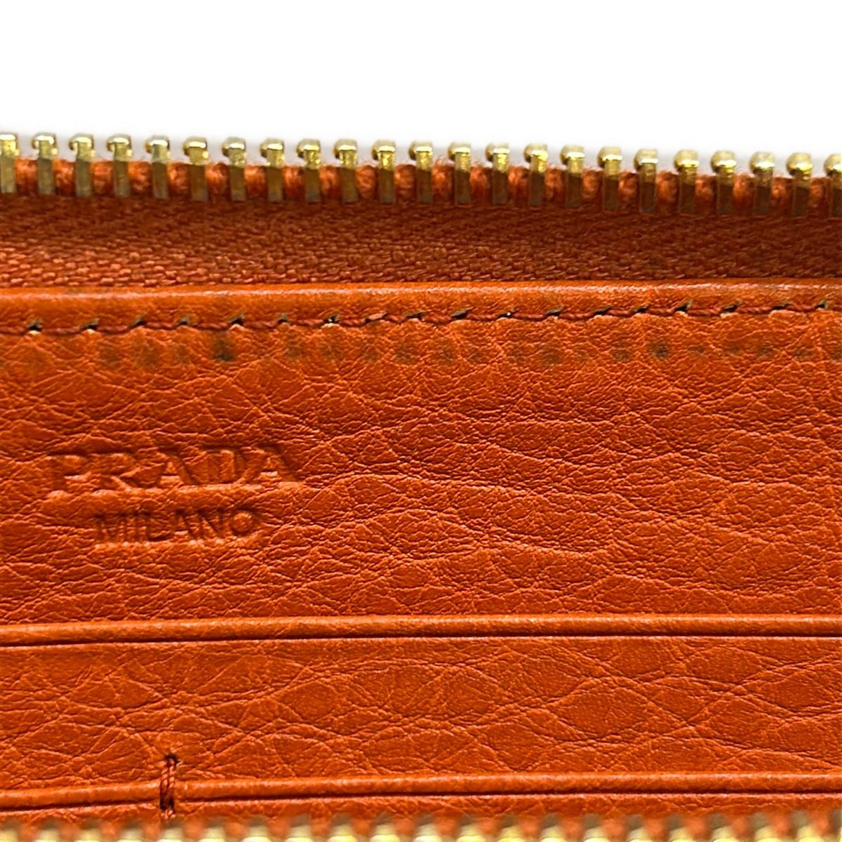 PRADA(プラダ) 長財布 - オレンジ ラウンドファスナー レザー