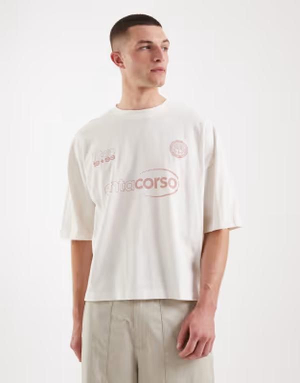 エイソス メンズ トップス Tシャツ グラフィック ASOS DESIGN boxy oversized tshirt with soccer graphicoconut milk オフホワイト
