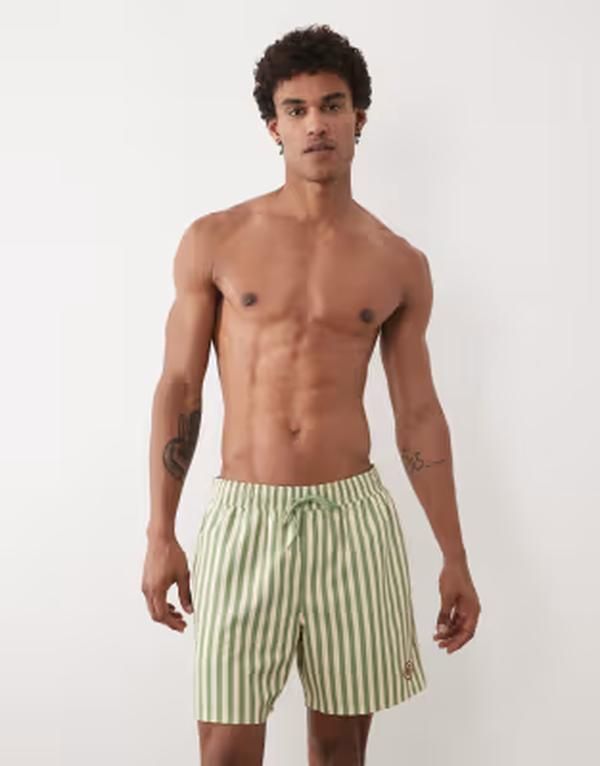 エイソス メンズ 水着 ハーフパンツ・ショーツ ショートパンツ ASOS DESIGN swim shorts in mid length in yellow and green stripes wi 9,734円